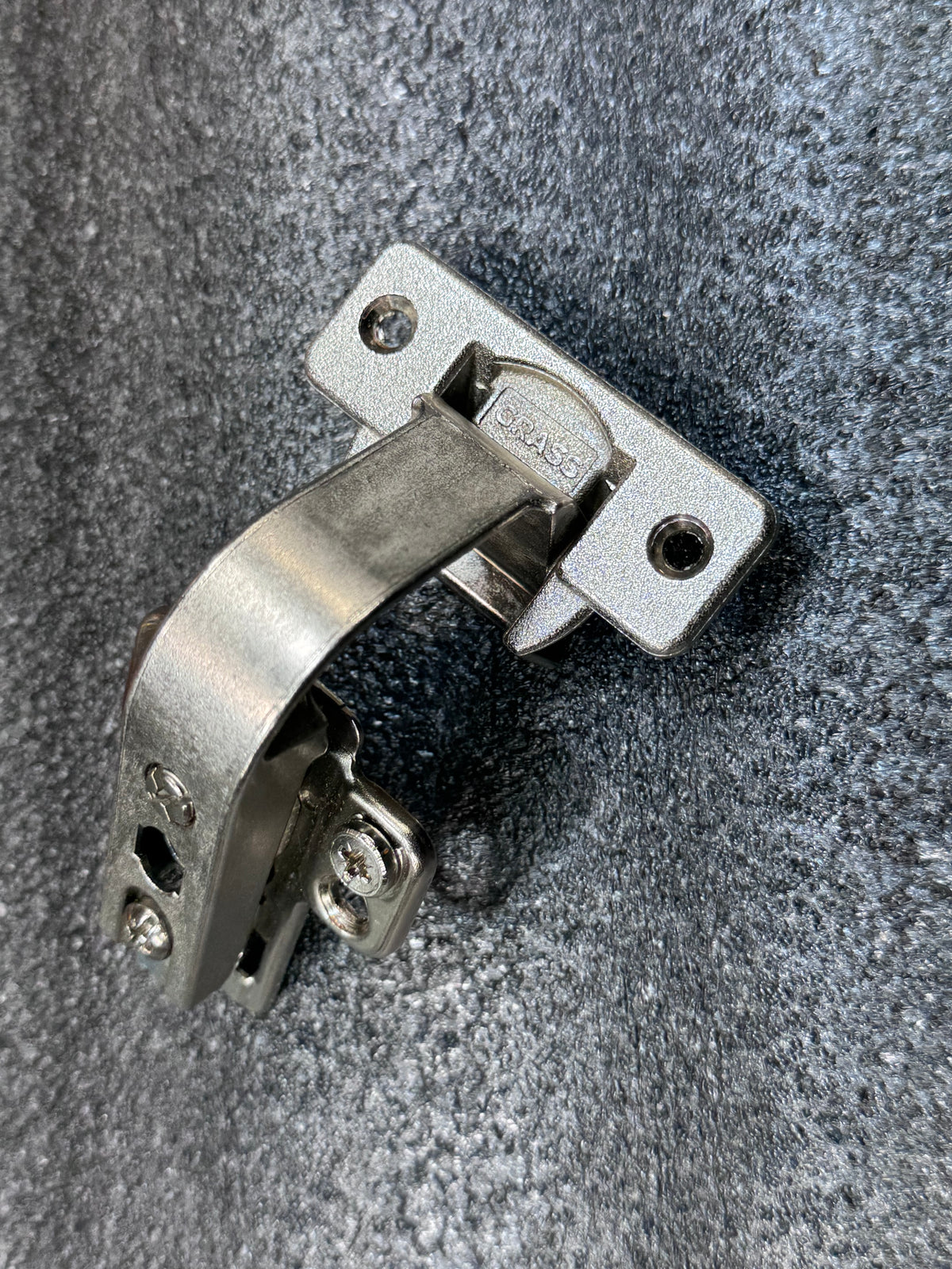 Grass/Mepla 699.299.05.00 bifold corner cabinet hinge with baseplate.