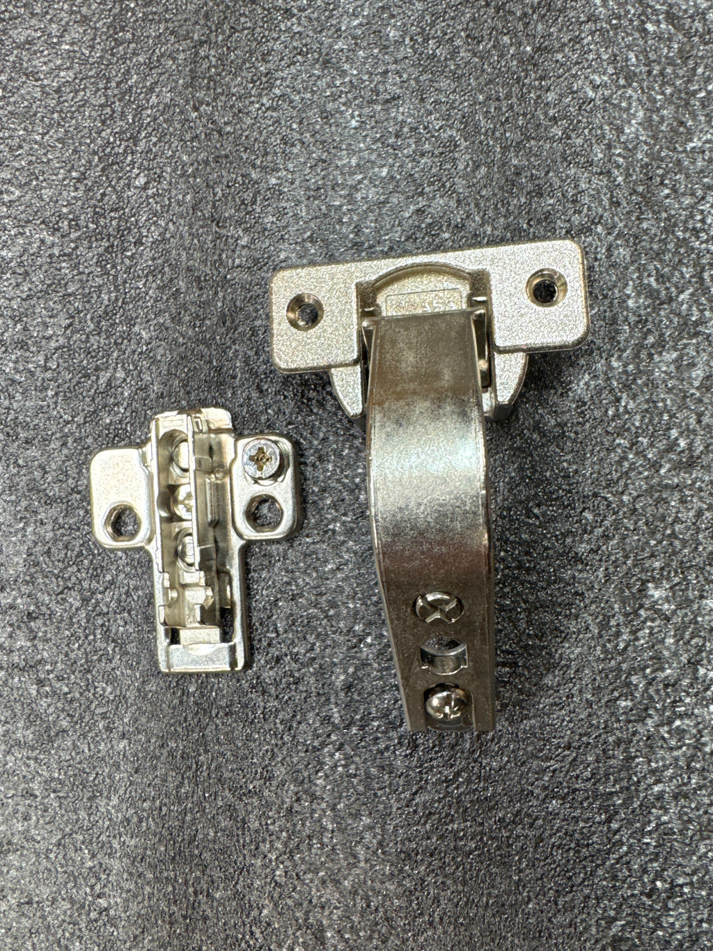 Grass/Mepla 699.299.05.00 bifold corner cabinet hinge with baseplate.
