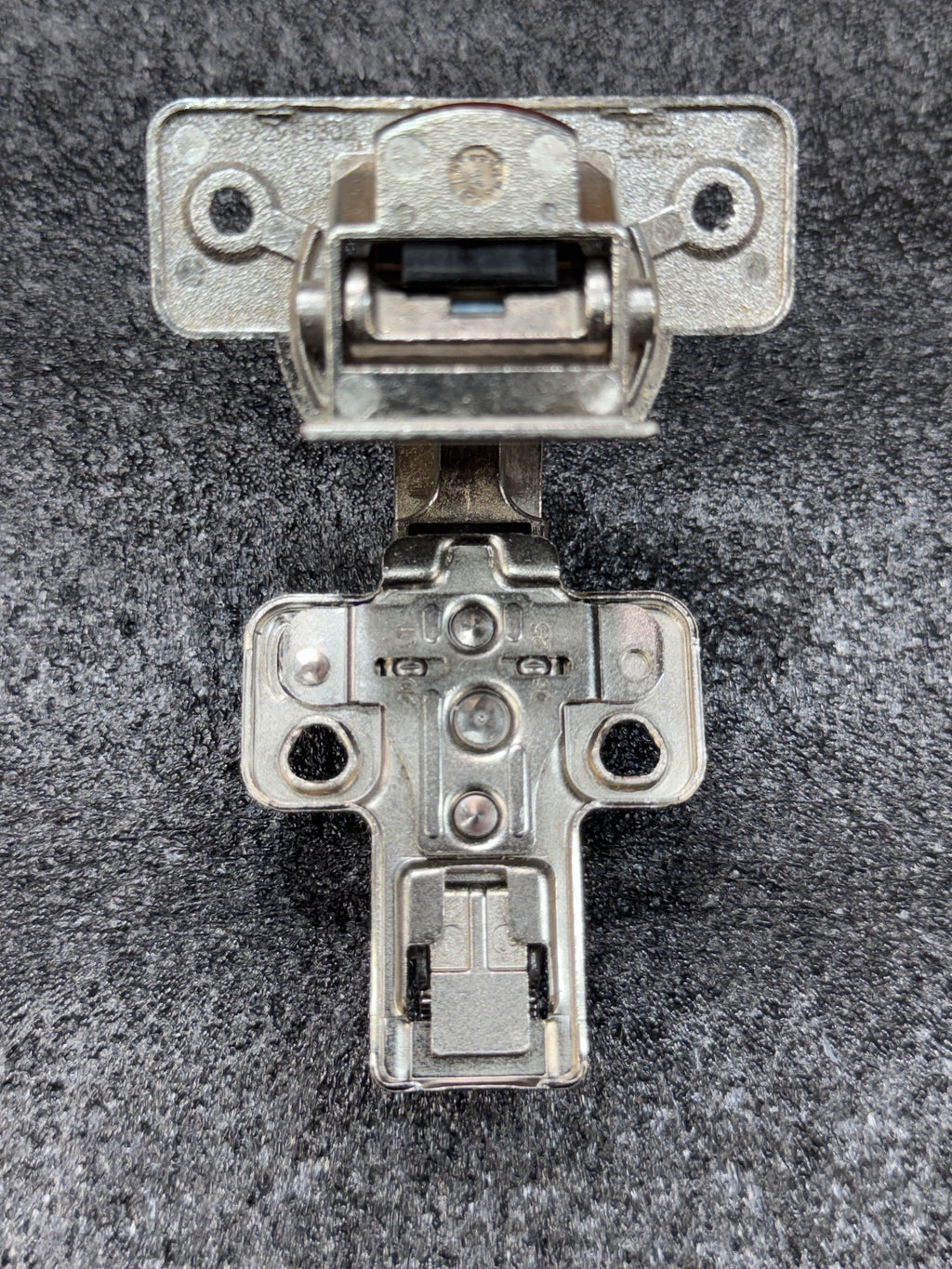 Grass/Mepla 699.299.05.00 bifold corner cabinet hinge with baseplate.