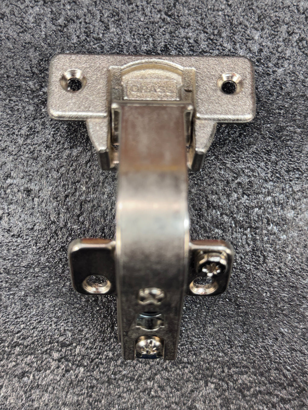 Grass/Mepla 699.299.05.00 bifold corner cabinet hinge with baseplate.