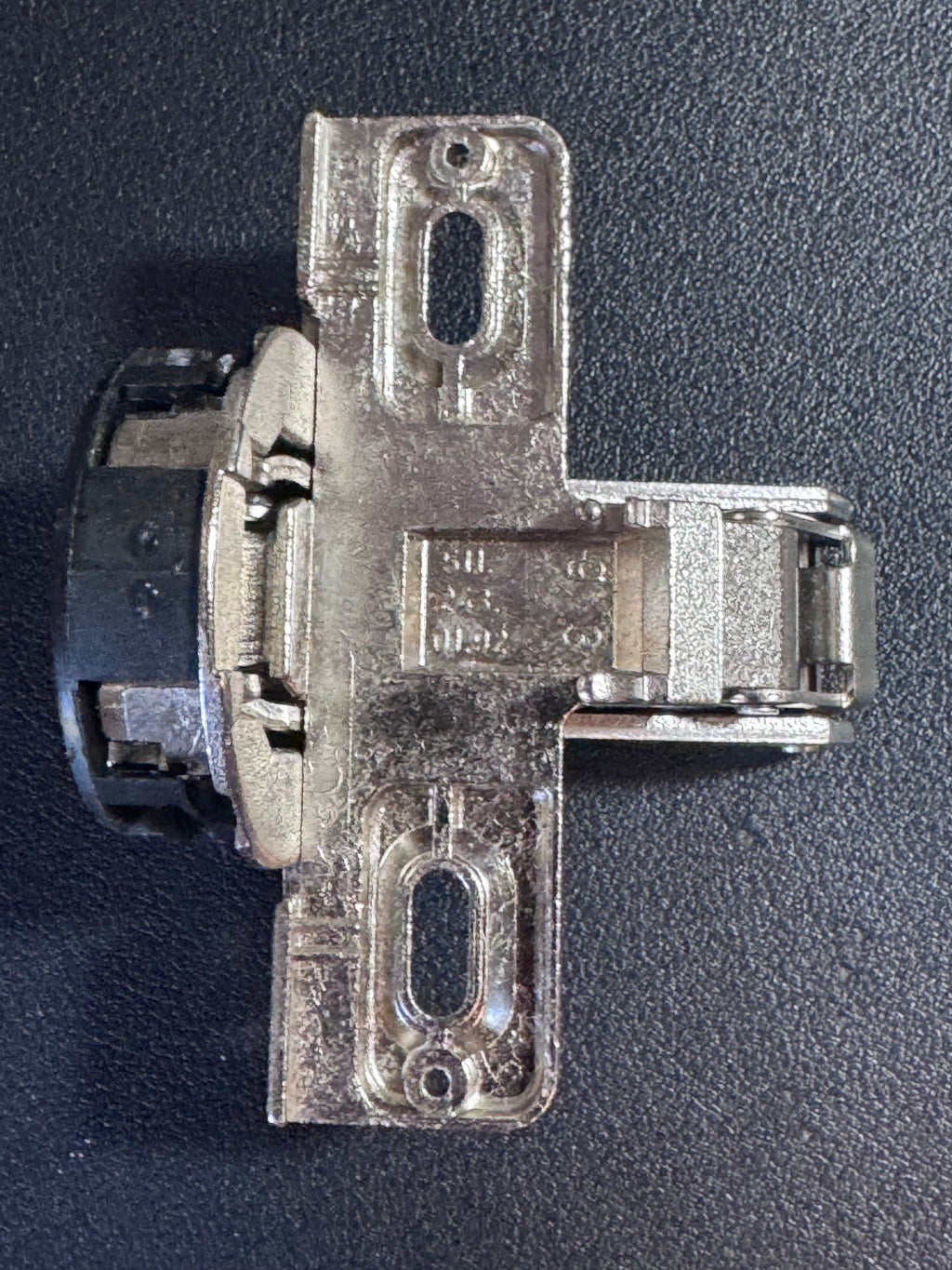 This listing offers ONE (1) genuine MEPLA cabinet hinge, identified by part number 698.243.59.00, with additional reference numbers 697.043.59.00 and 511.243.01.92.

