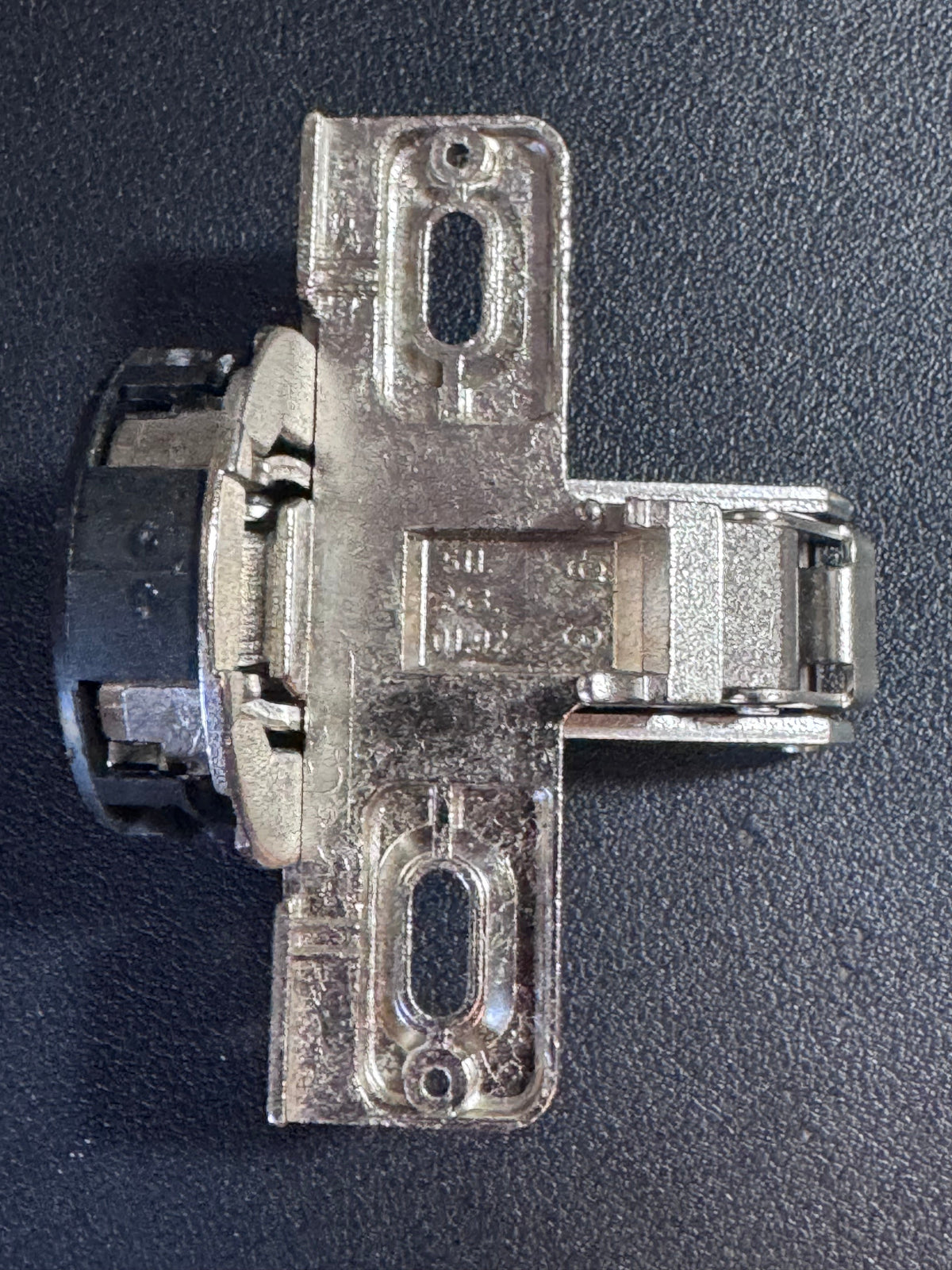 This listing offers ONE (1) genuine MEPLA cabinet hinge, identified by part number 698.243.59.00, with additional reference numbers 697.043.59.00 and 511.243.01.92.

